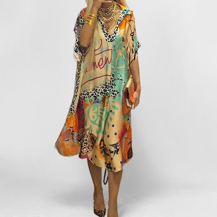 Women's graphic print flowy swing tunic dress with short sleeves and v-neck, perfect for summer casual wear.