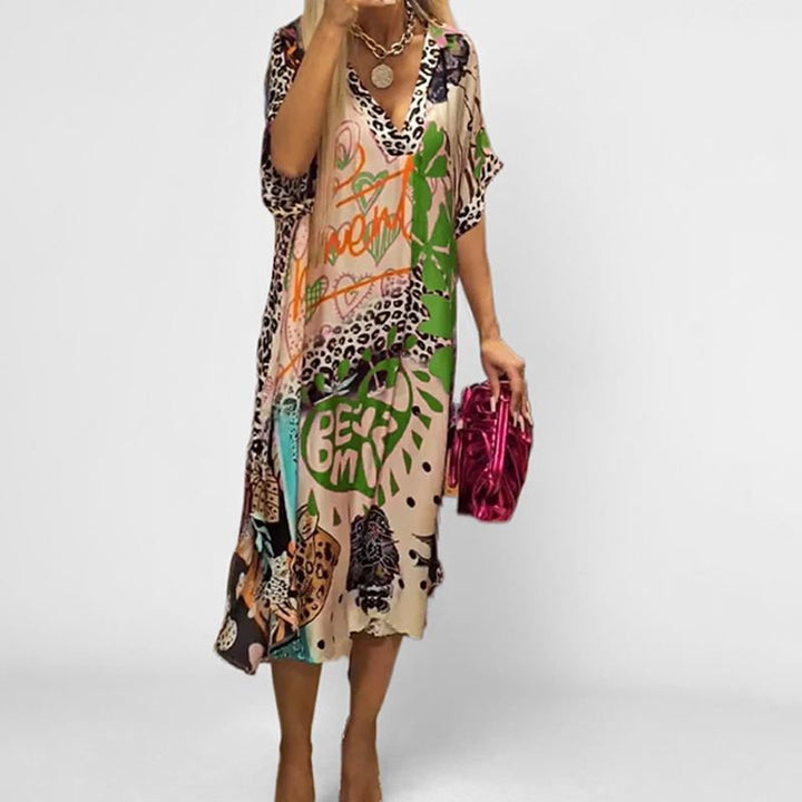 Comfortable knee-length women's printed swing tunic dress; short sleeve, v-neck, and flowy for vacation.