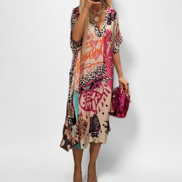 Stylish women's graphic print tunic dress, a short sleeve v-neck swing dress for casual summer days or vacation.