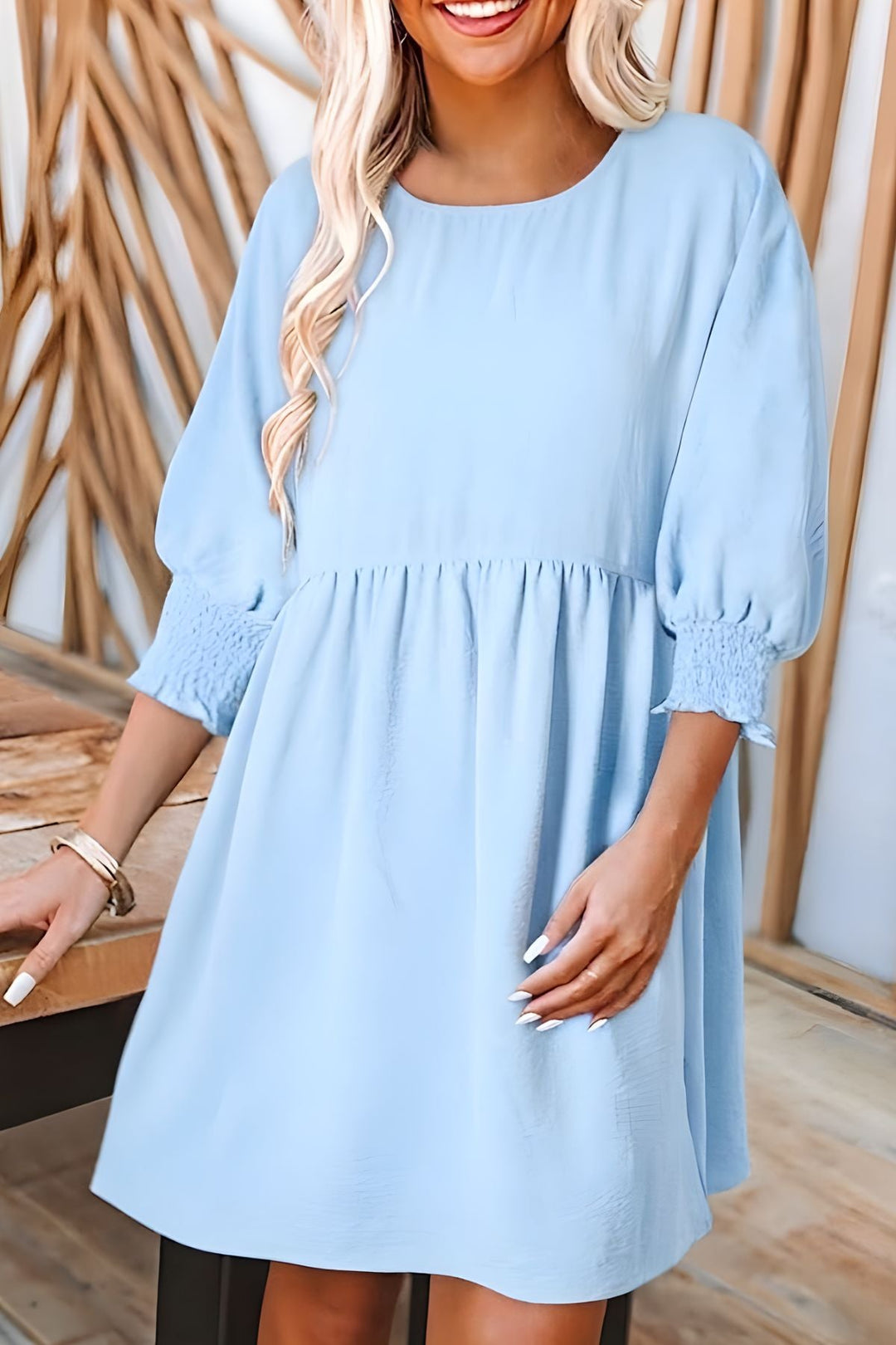 Stylish women's half sleeve babydoll mini dress, smocked details, tiered ruffles, ideal for summer.
