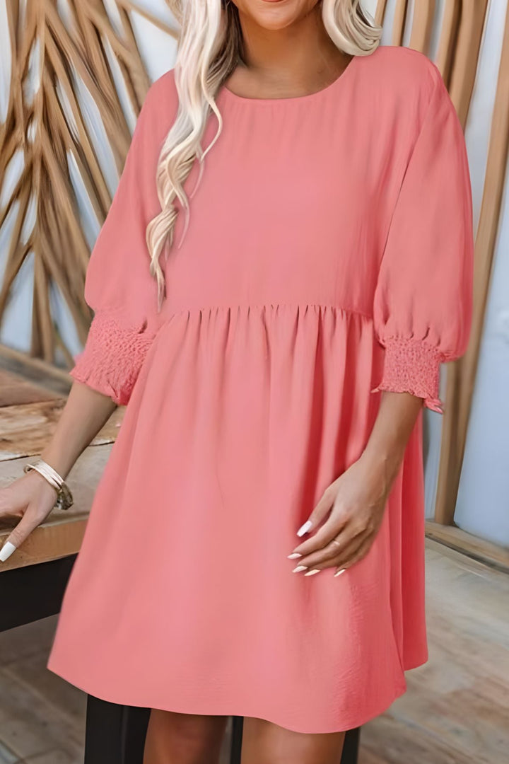 Trendy babydoll mini dress, women's half sleeve with smocked cuffs & tiered skirt, spring fashion.
