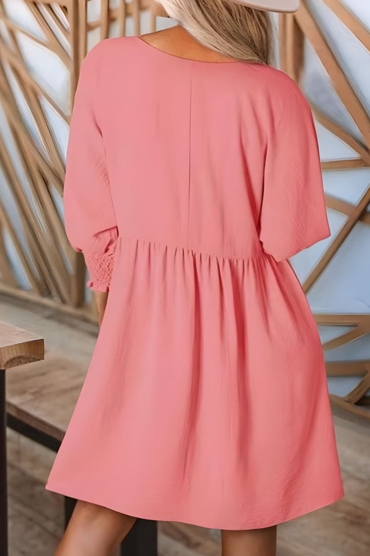Versatile women's babydoll mini dress, half sleeves, smocked cuffs, perfect for casual looks.