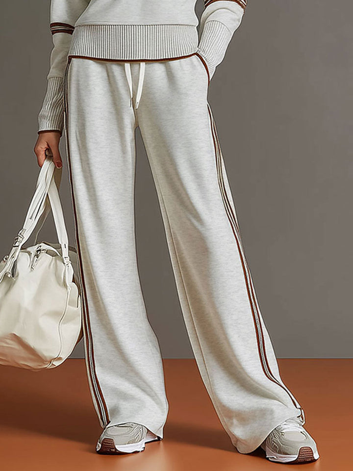 Women's relaxed fit half-zip sweatshirt and wide-leg trouser co-ord. A stylish and comfortable two-piece.
