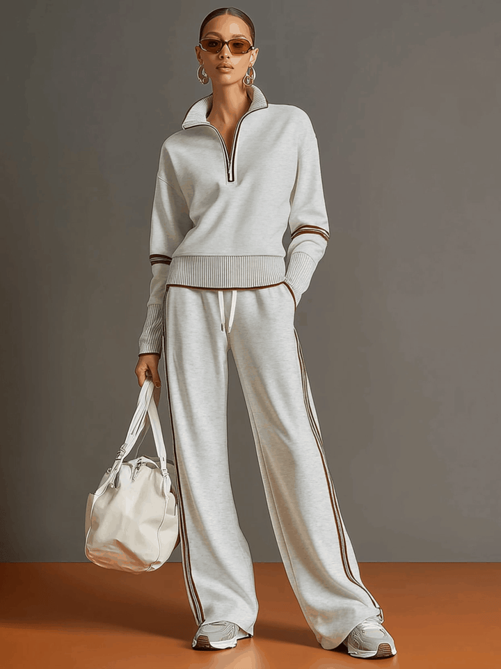 Chic two-piece women's athleisure set with a half-zip pullover and relaxed wide-leg trousers.