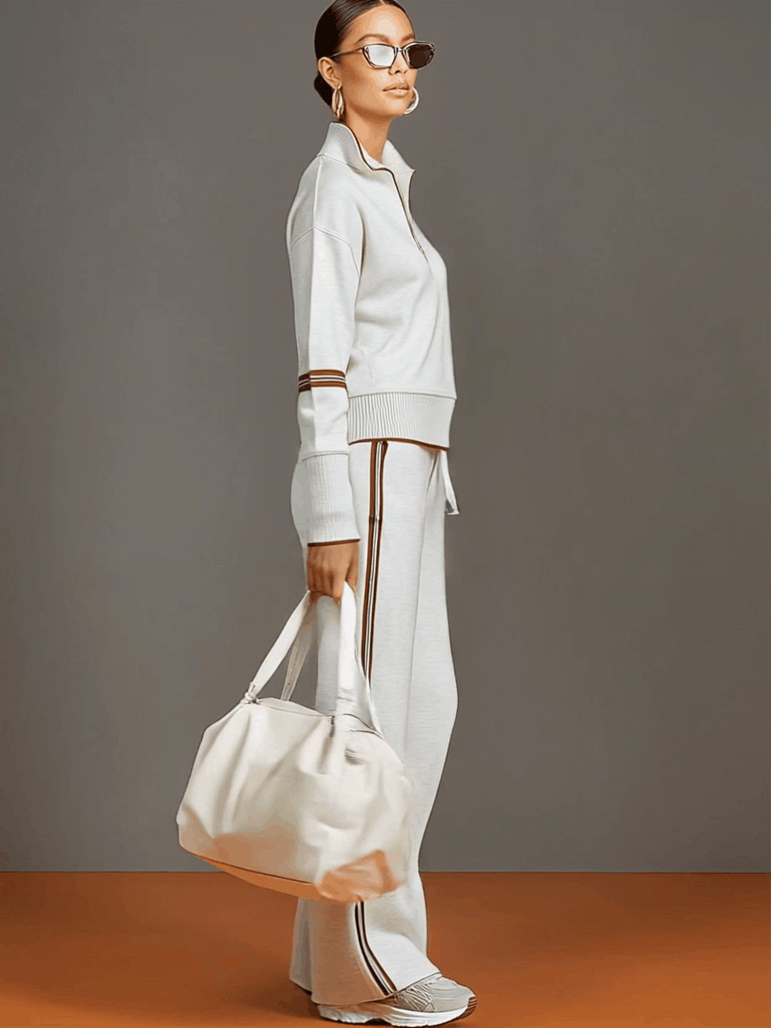 Comfortable women's co-ord set: stylish half-zip sweatshirt and flowing wide-leg casual trousers.
