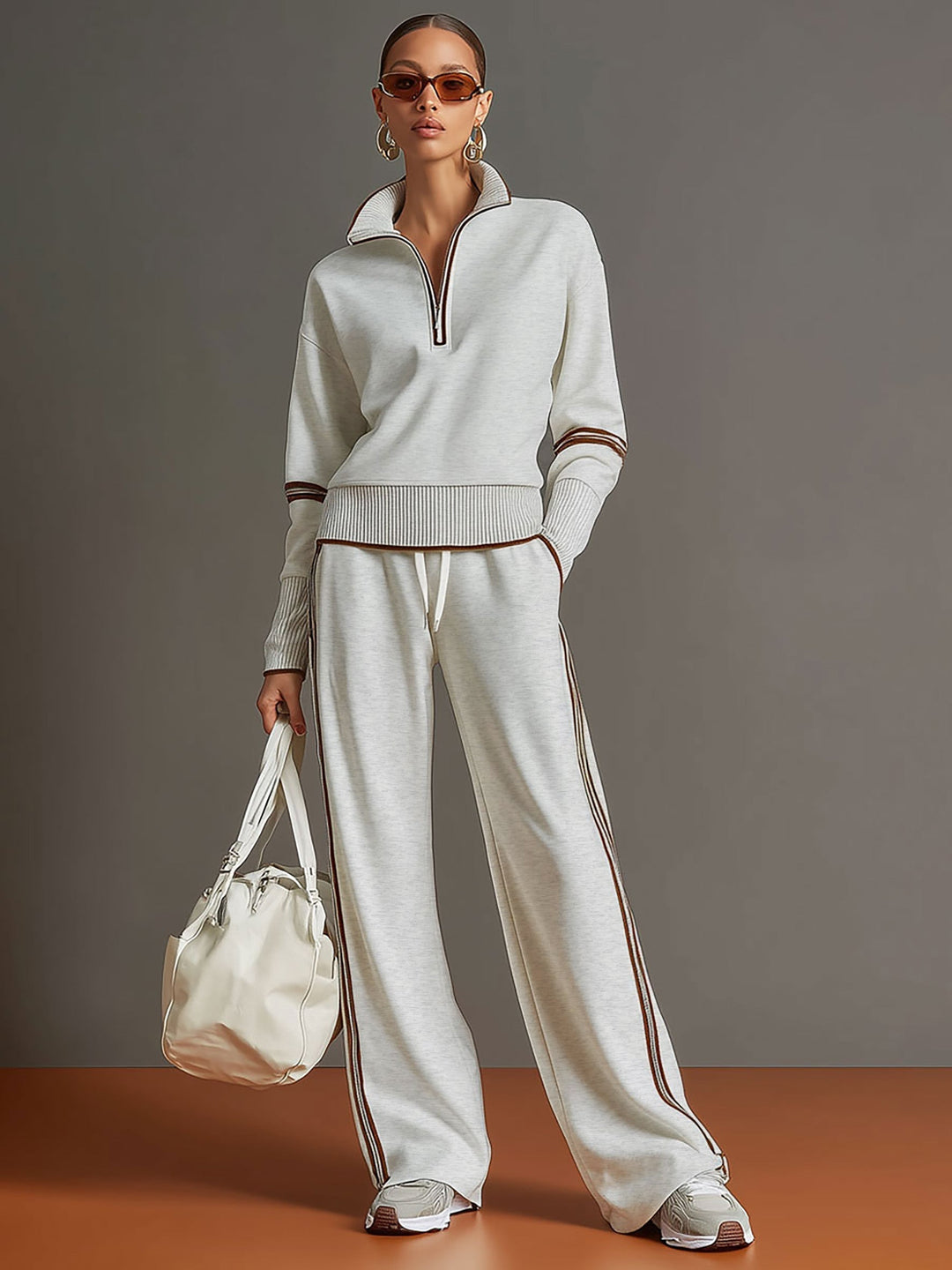 Versatile women's loungewear set featuring a cozy half-zip top and wide-leg trousers for casual wear.