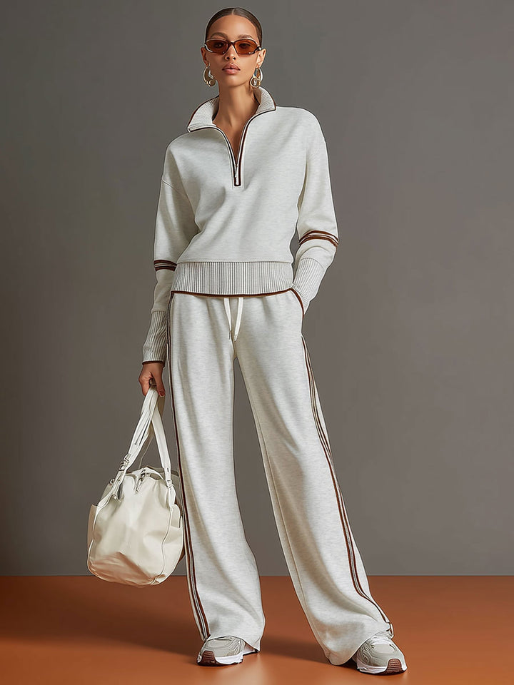 Versatile women's loungewear set featuring a cozy half-zip top and wide-leg trousers for casual wear.