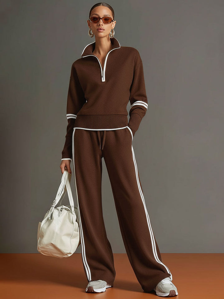 Fashionable women's wide-leg trouser & half-zip sweatshirt set. Perfect for relaxed, stylish outfits.
