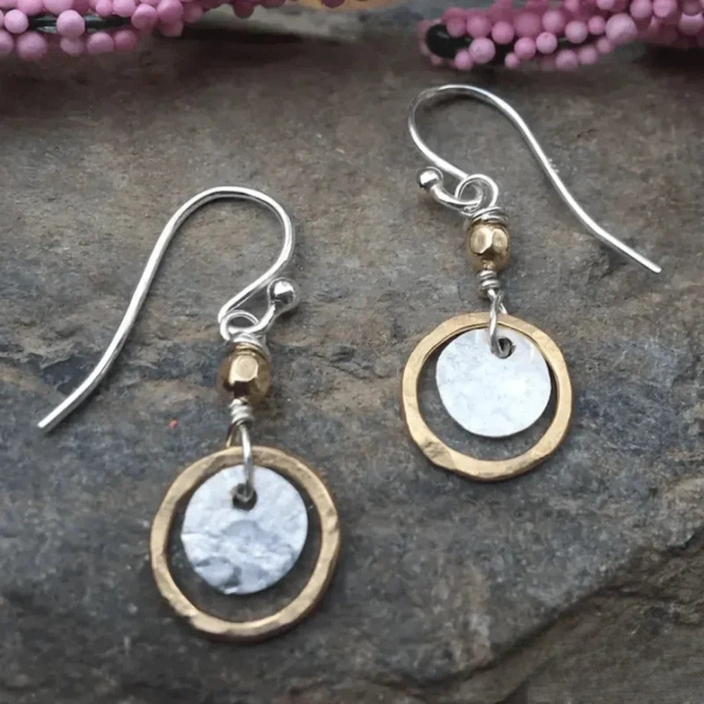 Women's hammered mixed metal disc drop earrings with gold & silver tones; versatile artisan dangle jewelry.