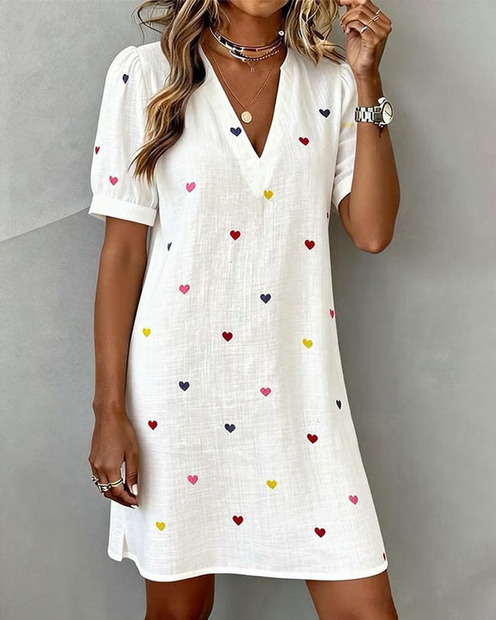 Women's heart print V-neck casual mini dress with puff sleeves. Ideal for summer everyday fashion.