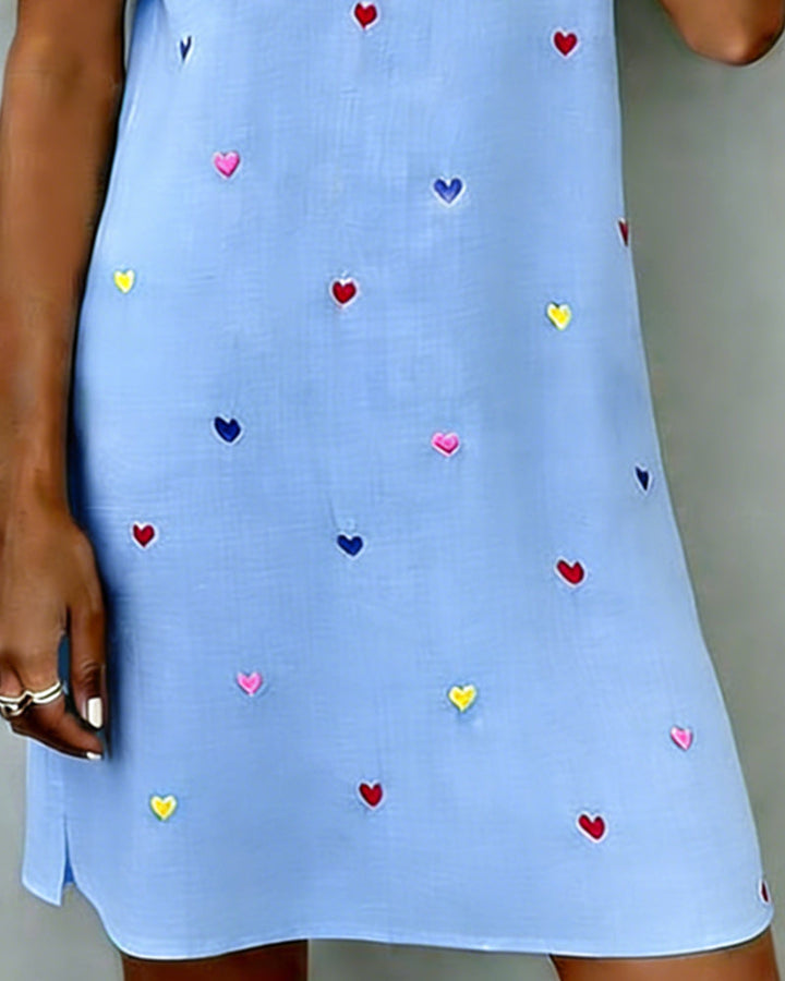 Versatile women's heart print casual V-neck dress with puff sleeves. Relaxed fit mini dress for summer occasions.