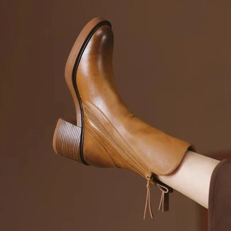 Women's high heel ankle boots with metal zipper, elegant for evening wear & fall winter fashion.