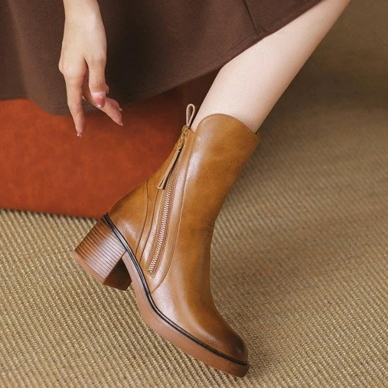 Side view of women's dressy high heel ankle boots with a shock-absorbing sole, perfect for fall.
