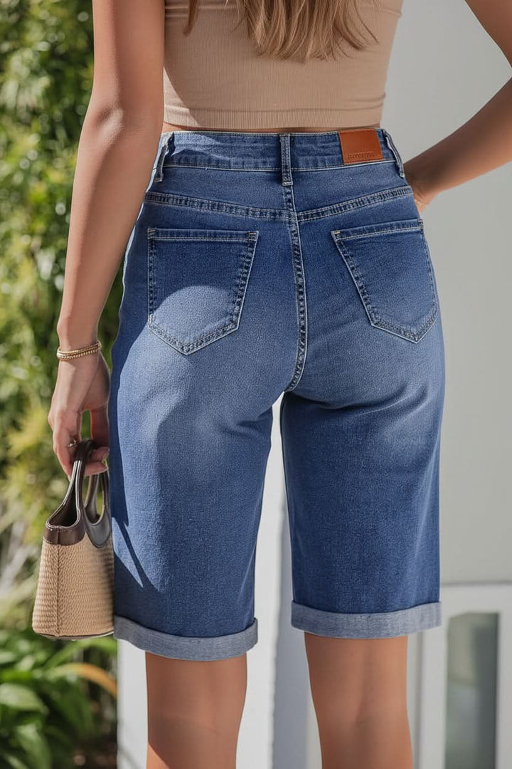 Flattering women's high-rise long shorts with a relaxed fit for modern, chic summer style.