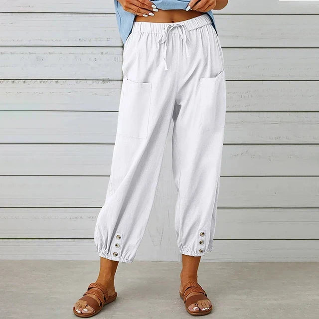 Elegant women's ankle-length tapered pants, high waist with drawstring and button cuffs.