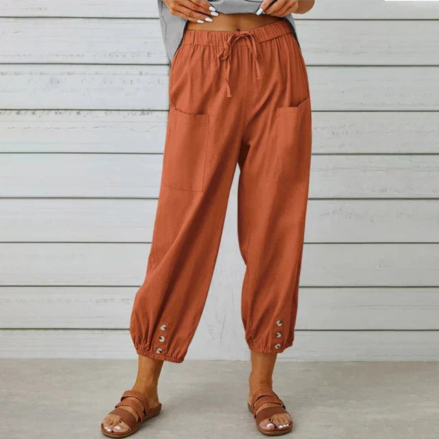 Modern women's tapered pants, featuring a comfortable high waist and adjustable drawstring.