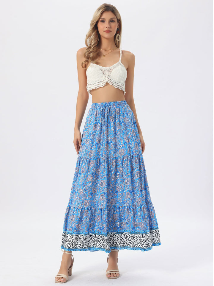 Elegant flowing printed maxi skirt, high-waist, women's, with a flattering side slit.