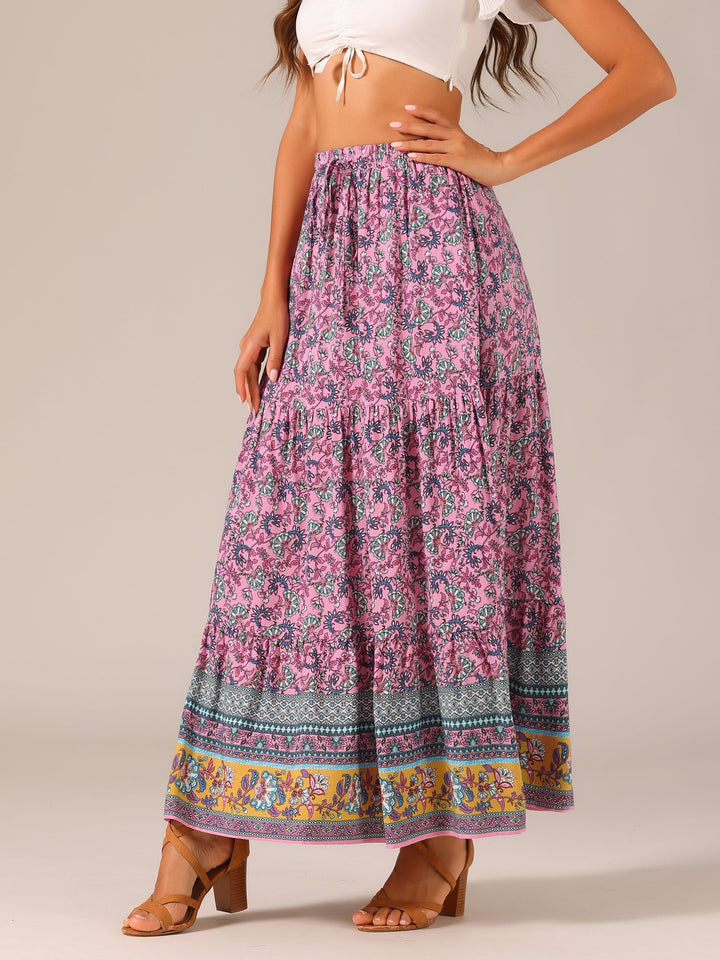 Casual chic: Women's high-waist flowing printed maxi skirt featuring a side slit.