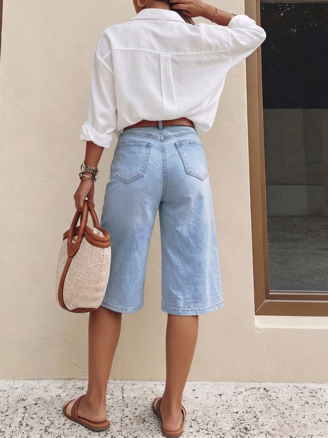 Relaxed fit light blue high waist wide leg culotte shorts for women, ideal for versatile summer fashion.