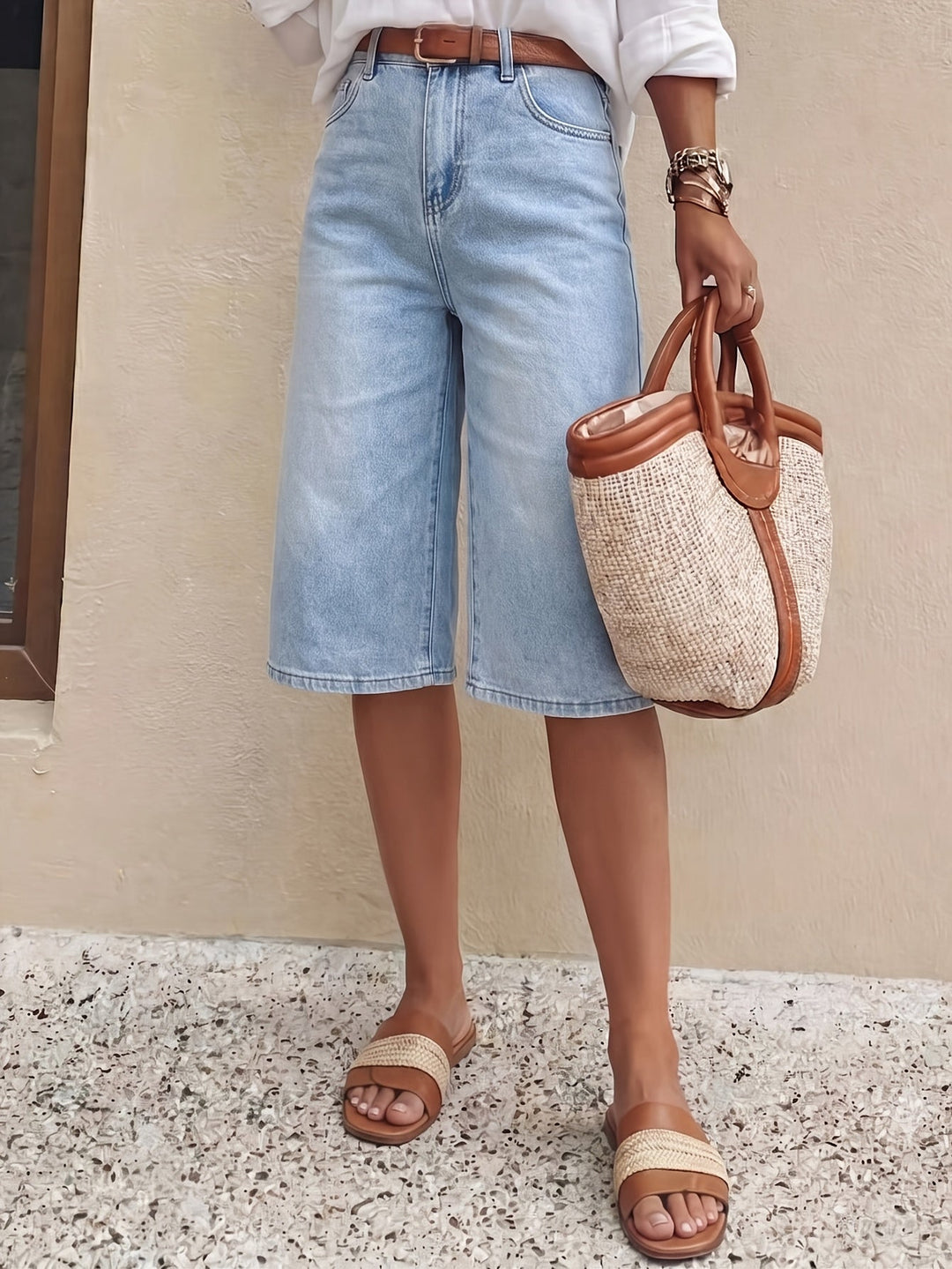 Light blue women's high waist culotte shorts with a wide leg and cropped cut, great for spring/summer style.