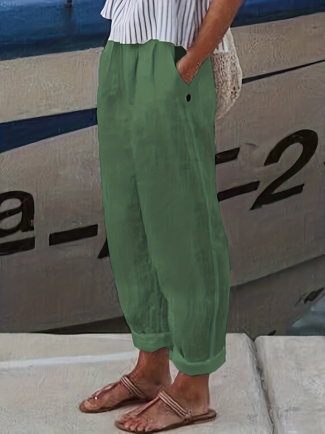 Stylish women's high waist pants, relaxed fit, designed with a practical roll hem for comfort.