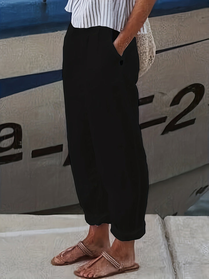 Everyday women's high waist pants, relaxed through leg, featuring a comfortable roll hem.