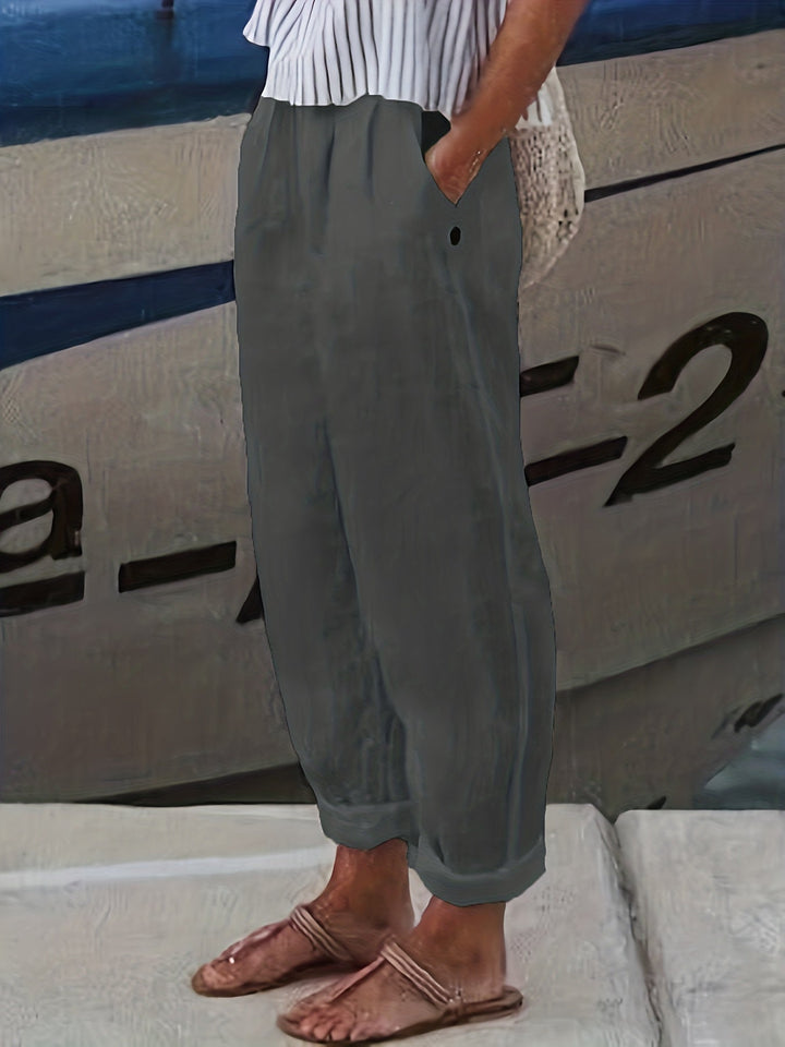 Chic women's casual pants, high waist & relaxed design, with a flattering roll hem.
