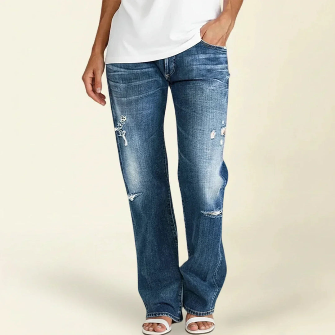 Women's high waist ripped blue jeans with a trendy straight leg and distressed details, perfect for casual wear.
