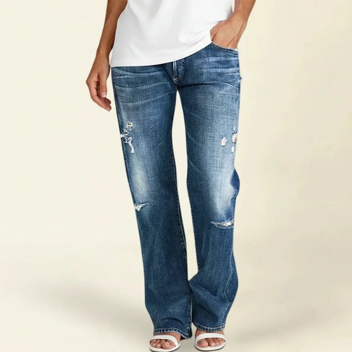 Women's high waist ripped blue jeans with a trendy straight leg and distressed details, perfect for casual wear.