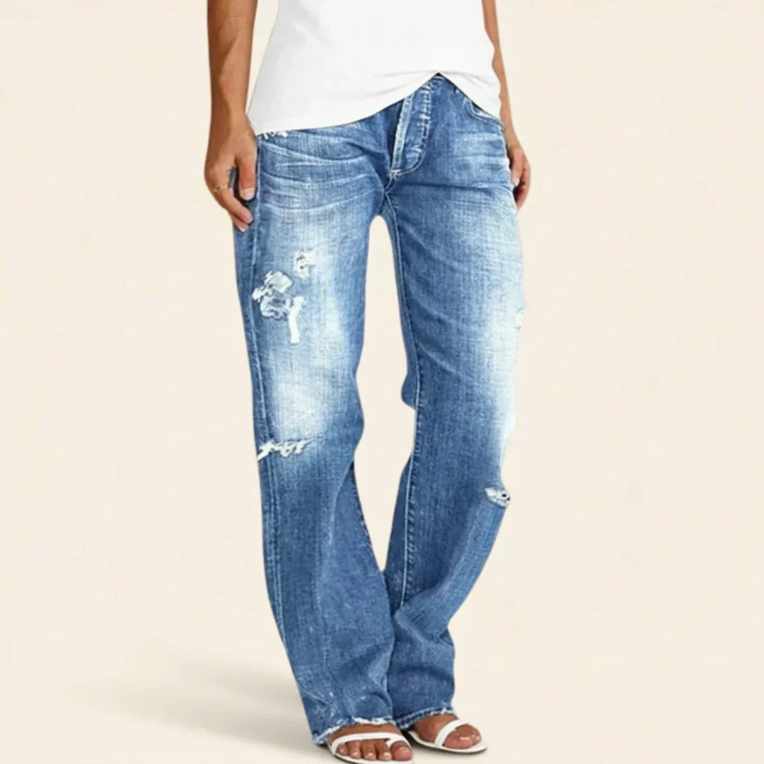 Chic women's distressed high waist straight leg jeans, offering a relaxed fit for stylish everyday wear.