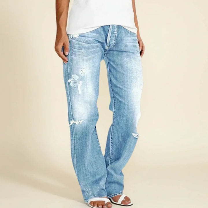 Fashionable women's distressed ripped high waist straight leg blue jeans, a trendy choice for womenswear.