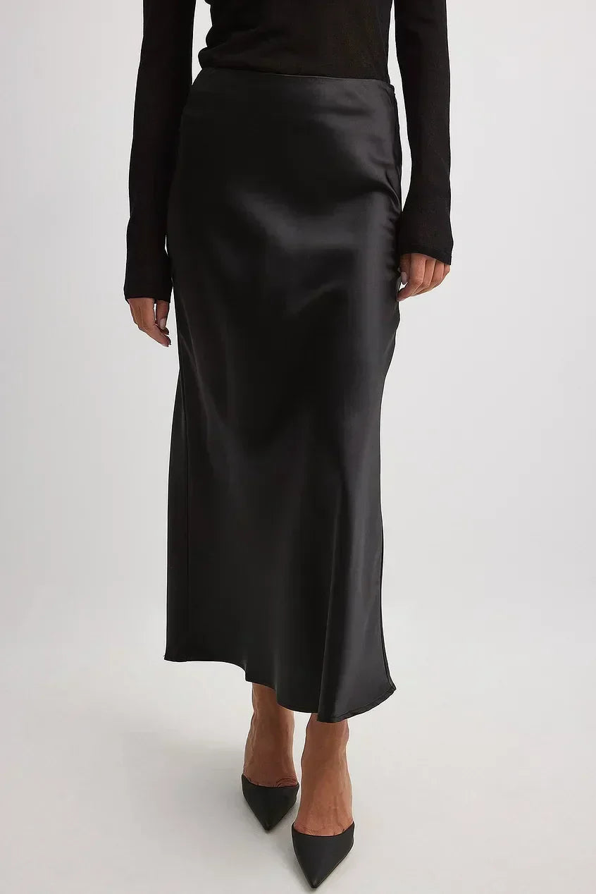 Elegant high-waist midi skirt for women, featuring beautiful flowing satin fabric.
