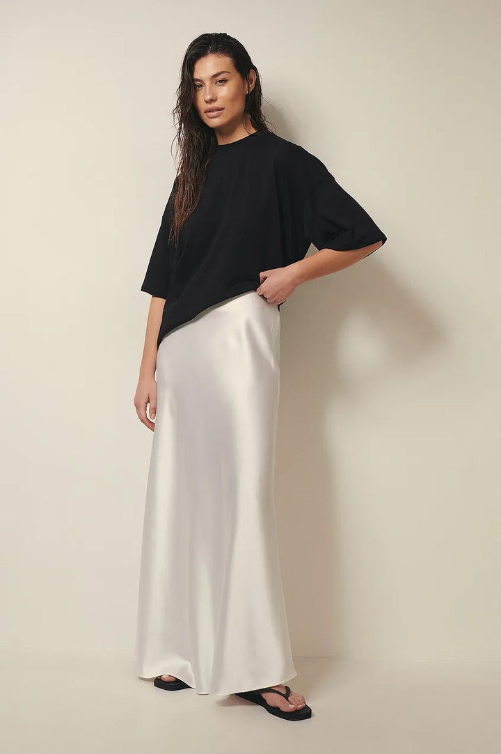 Ladies' high-waist satin flowing midi skirt, perfect for elegant party wear.