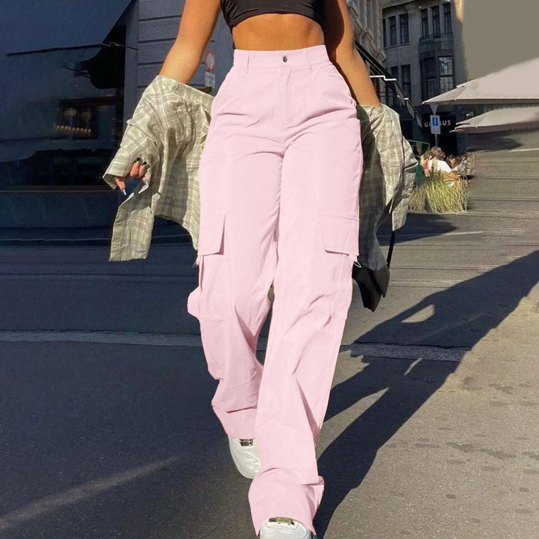 Modern women's utility cargo pants, high waisted with a wide leg cut and large functional pockets.