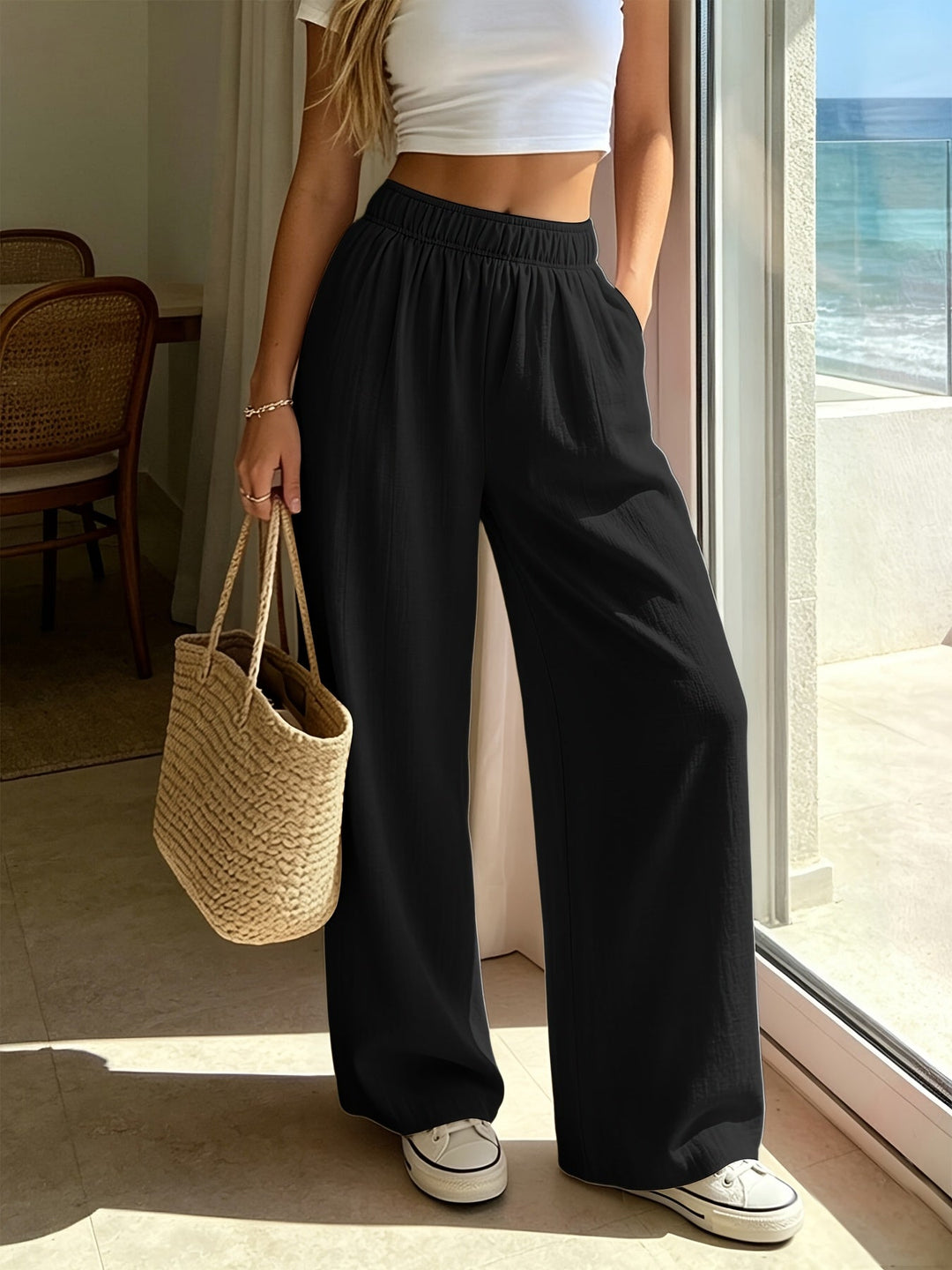 Elegant women's wide leg pants with high waist, versatile for casual wear or resort style.