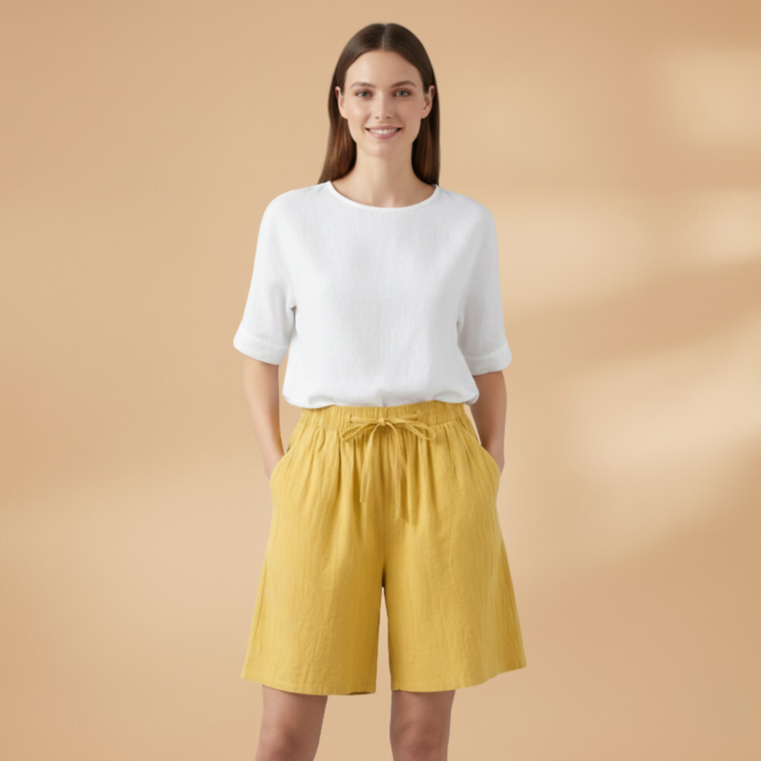 Loose fit women's drawstring shorts, high waist & wide leg, perfect for beach & resort wear.