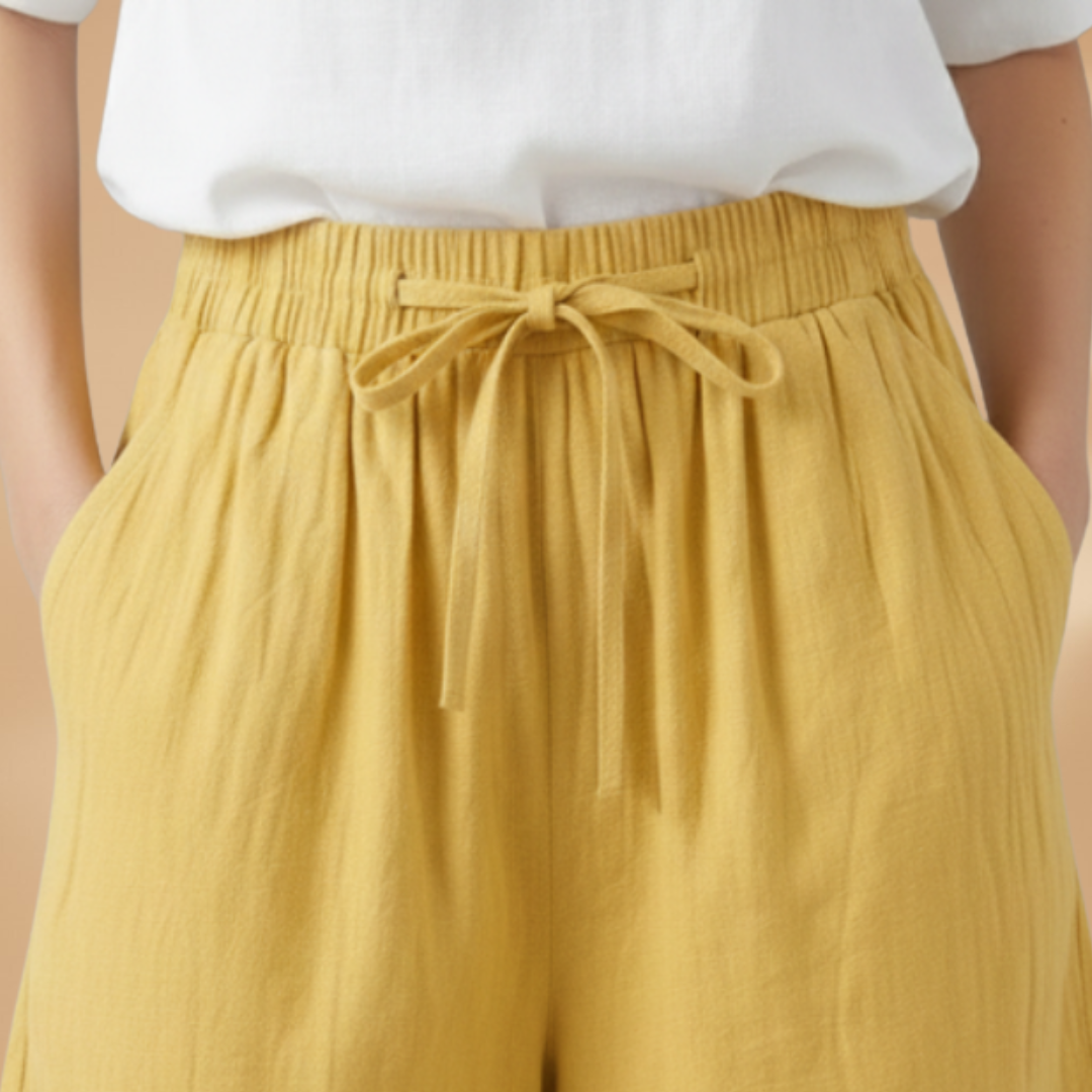 Elasticated waist women's shorts, wide leg & high waist with a practical drawstring closure.