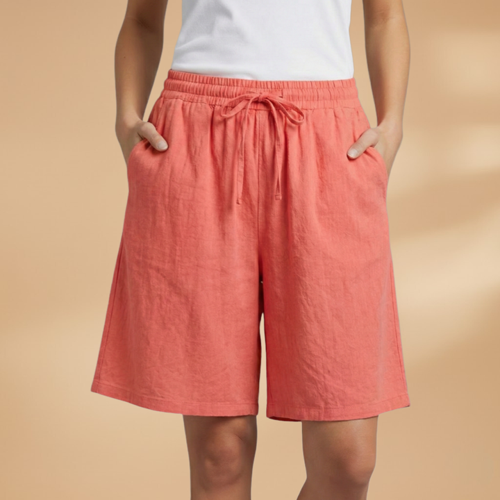 Relaxed fit women's drawstring shorts, high waist and wide leg, essential resort wear.