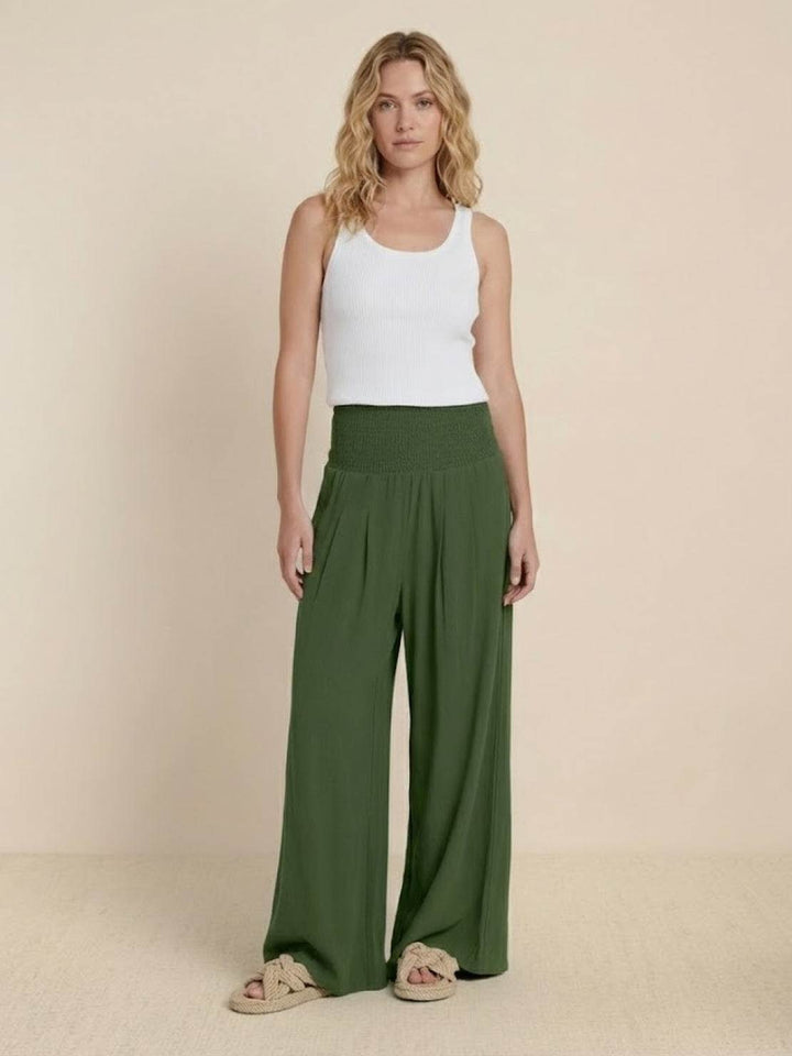 Comfortable women's wide leg trousers with a smocked high waist, perfect for casual style any day.