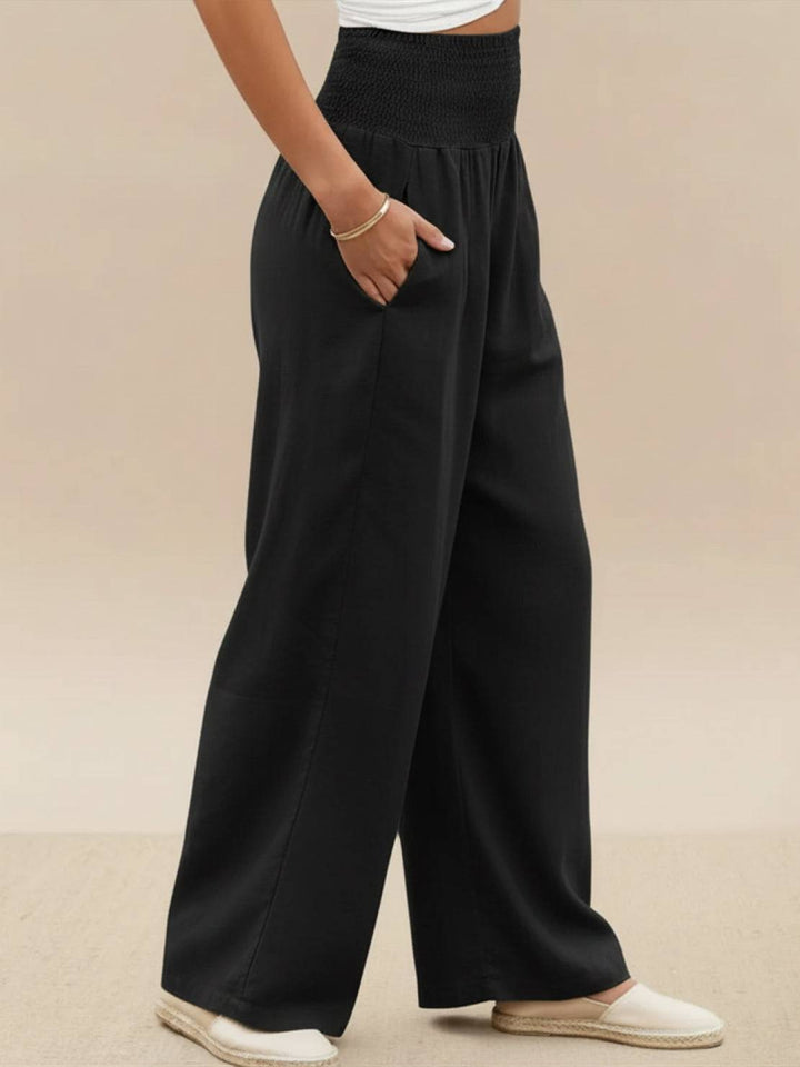 Stylish smocked waist wide leg pants for women, comfortable for spring/summer and casual outfits.