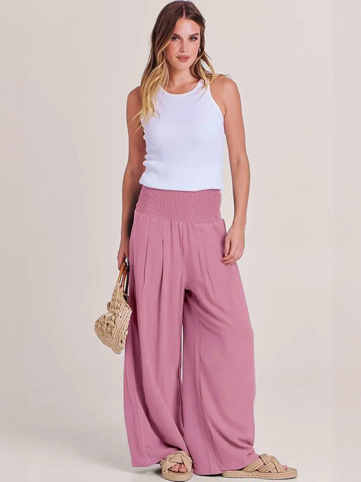 Chic women's smocked high waist wide leg trousers, perfect for relaxed summer days and casual wear.