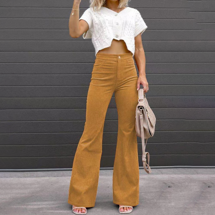 Retro-inspired Kristin women's flared trousers, high-waisted & ribbed for a comfortable fashion.