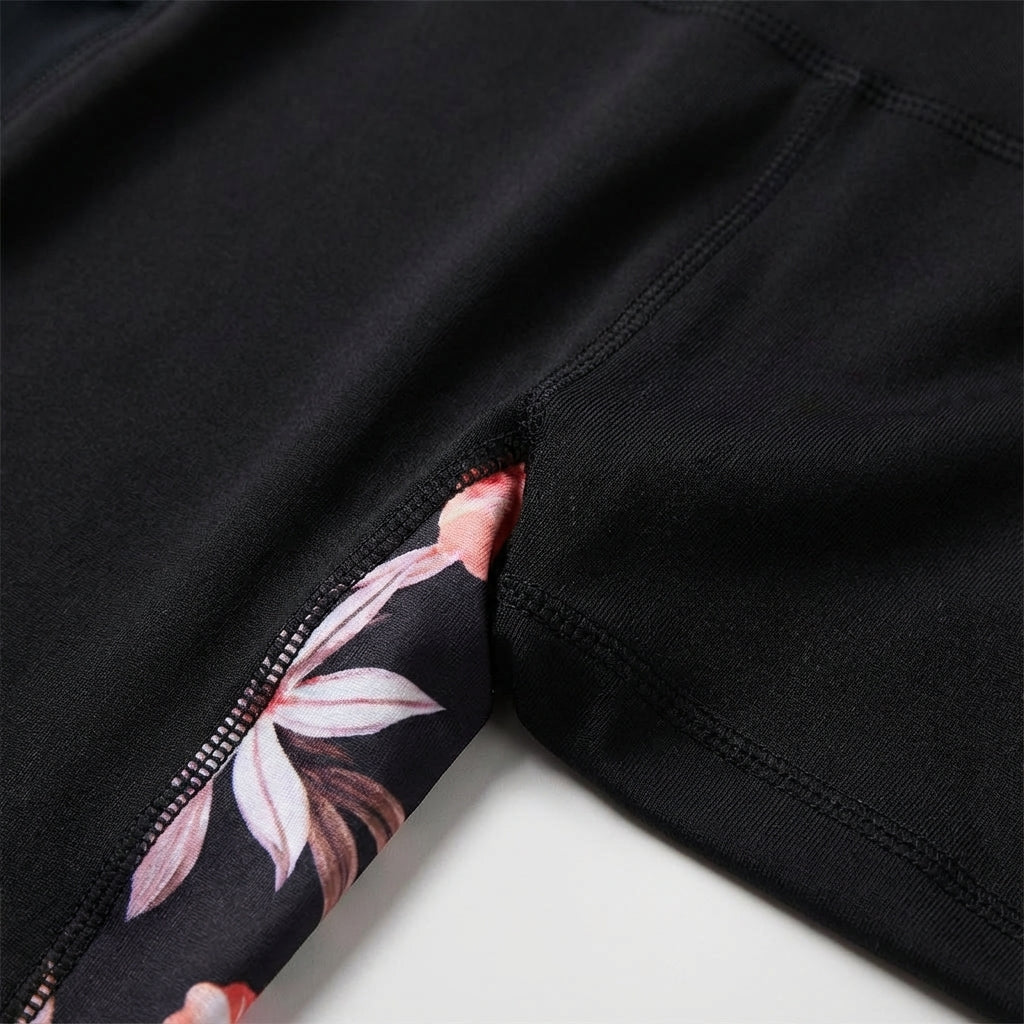 Floral high-waisted women's sports leggings with pockets, stretchy & opaque for active comfort.