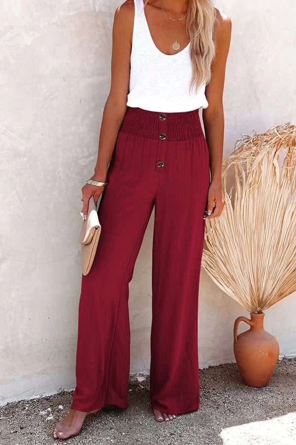 Chic women's tailored high waist trousers featuring button detail, perfect for elegant everyday wear.