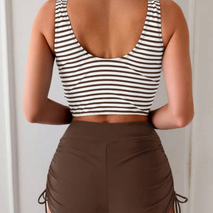 Comfortable women's high-waisted tankini set. Features a modern cross-wrap swim top design.
