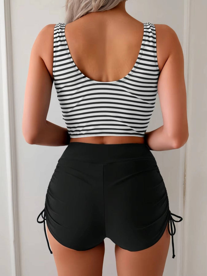 Cross-wrap swim top & high waisted tankini bottom for women. Ideal for pool or beach.