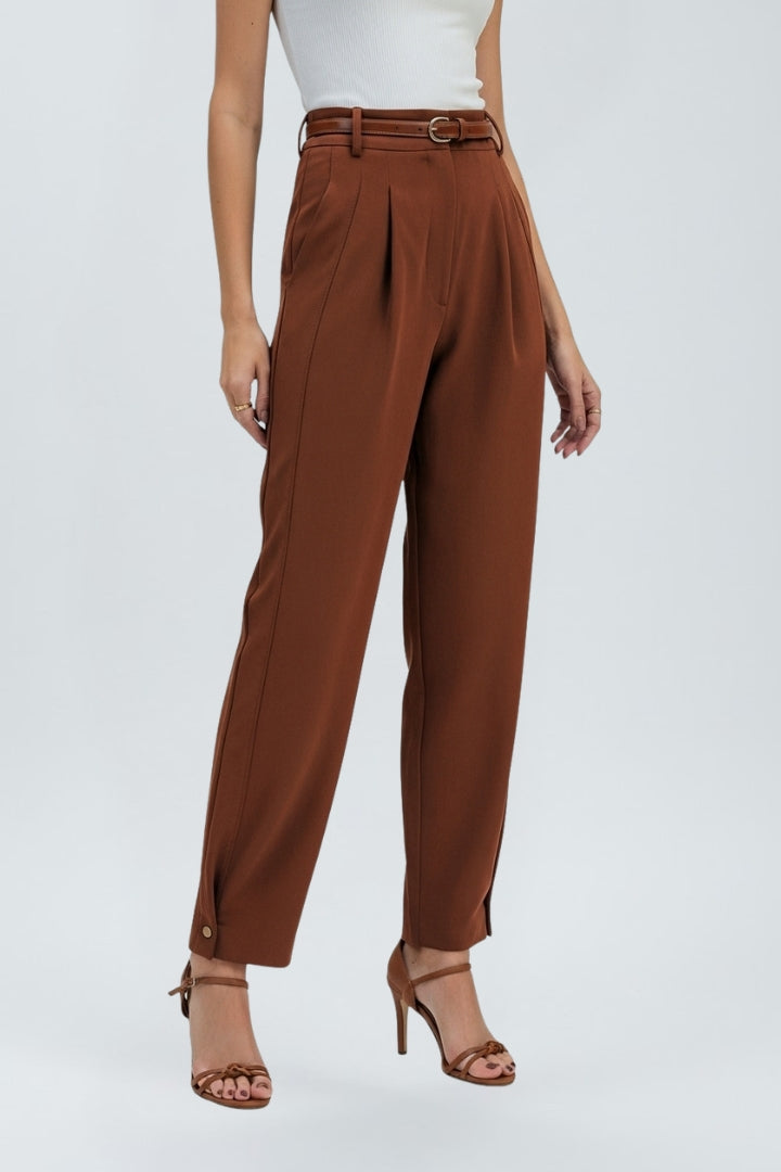 Fashionable women's high-waisted tapered trousers with a chic belt, creating a modern and polished look.