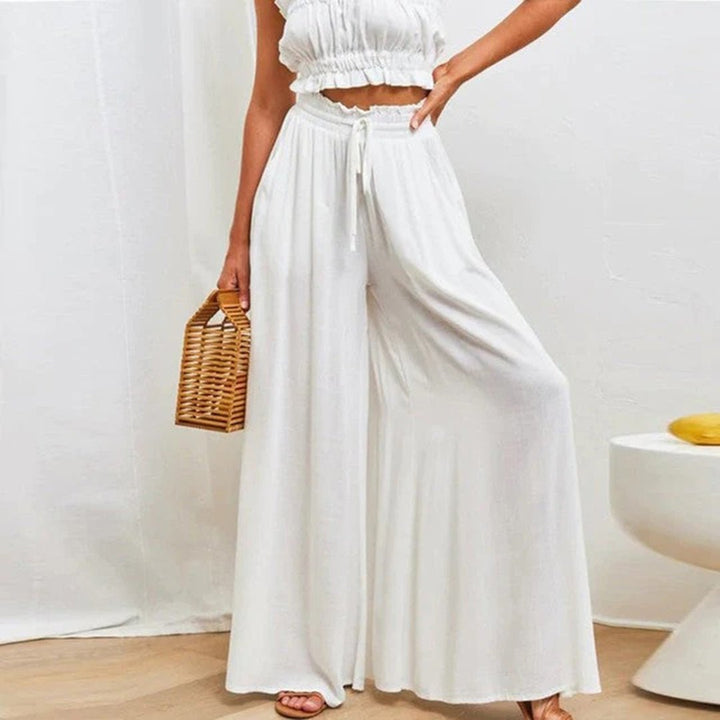 Women's high waisted wide leg palazzo pants with a flowing fit, ideal for comfort.
