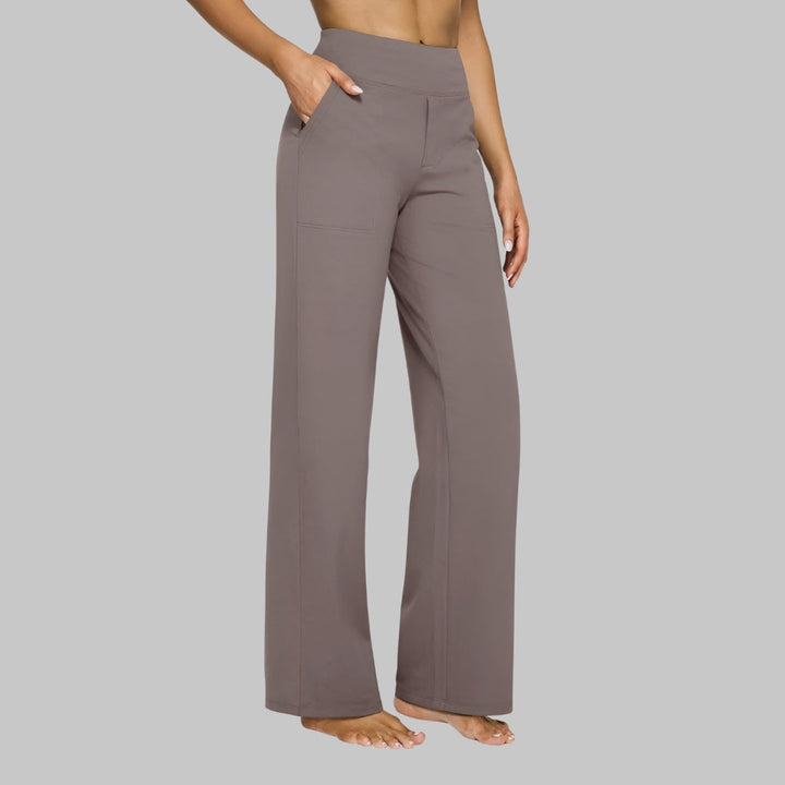 Chic women's wide-leg pants, high-waisted with pockets, ideal for versatile work or casual wear.