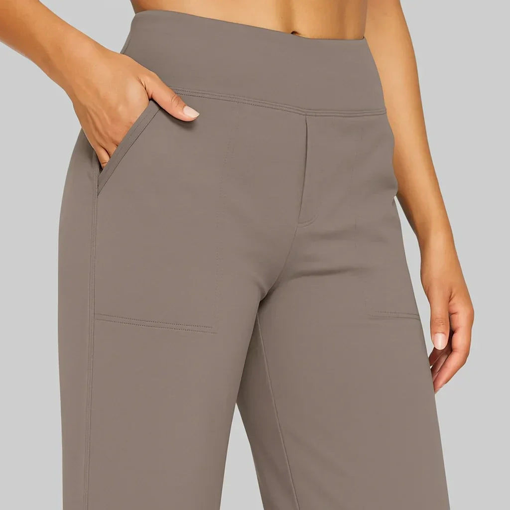 Versatile high-waisted wide-leg women's pants with side pockets for casual or professional looks.